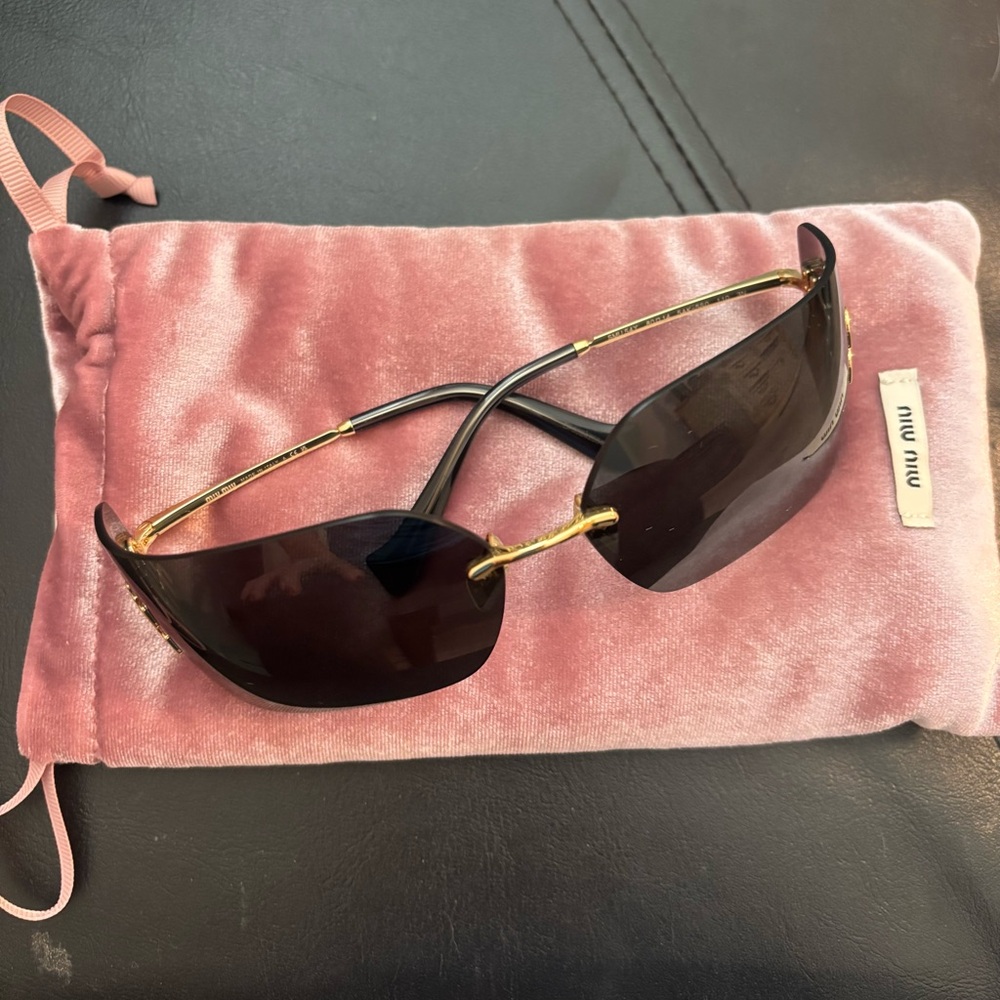 Miu Miu Black and Gold Sunglasses